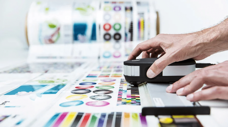 Operator managing prepress workflow with advanced flexographic equipment.