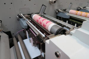 Image showing advanced flexographic printing equipment producing high-quality labels, emphasizing innovations in label printing technology.