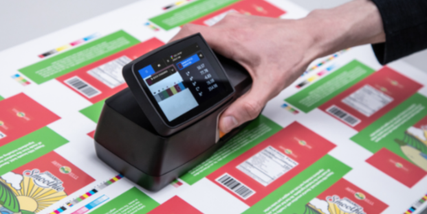 Handheld X-Rite eXact 2 spectrophotometer with touchscreen display, used for precise color measurement in printing and packaging industries.