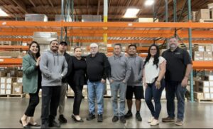 A&V team celebrating Anderson & Vreeland’s legacy of 65 years in flexographic printing excellence.