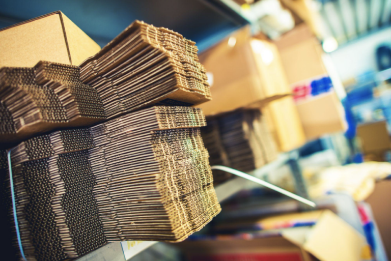 Stacks of corrugated cardboard used in flexo printing with corrugated mounting supplies.